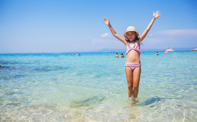 Happy Child Having Fun On The Beach