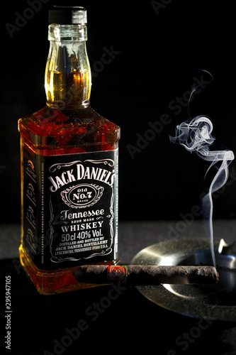 Cuadros en Lienzo Minsk, Belarus - January 25, 2016: Bottle of Jack Daniel’s near ashtray with smo