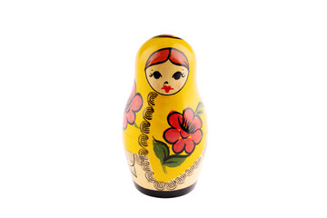 yellow russian nesting doll isolated on a white background.