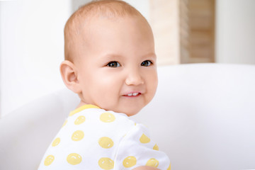 Portrait of cute little baby at home