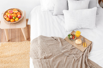 Canvas Print - Interior of modern bedroom with breakfast on bed