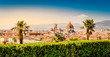 Florence, Italy: scenic view on famous italian town with Duomo and palm trees at sunset