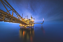 Industrial Offshore Oil And Gas,Oil Rig Platform With Milky Way At Night