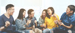 © ChayTee - Banner of asian group of friends talking and laughing with happy in gathering meeting sitting at home feeling cheerful and enjoy game in leisure time together. People in blue or yellow wearing.