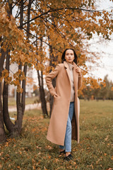 Wall Mural - Beautiful lady in autumn landscape