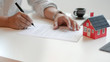 © bongkarn - Close-up view of customer signing contract about home loan agreement