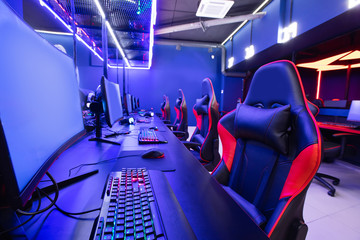 Wall Mural - Professional gamers cafe room with powerful personal computer game chair blue color. Concept cyber sport arena