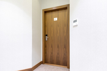 Hotel room door with number