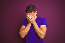 Young Man Wearing Casual Purple T-shirt Over Lilac Isolated Background With Sad Expression Covering Face With Hands While Crying. Depression Concept.