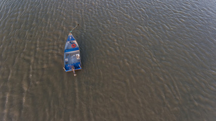 Canvas Print - Aerial. An old fishing boat from above, on the Tejo River, in the Samouca Marina. Lisbon.