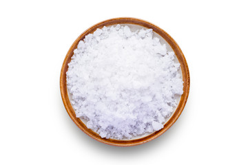 Closeup coarse or rock natural sea salt in brown bowl isolated on white background. Clipping path. Top view.