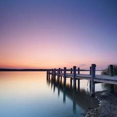 Canvas Print - langer Holzsteg am See