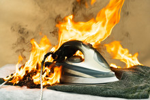 They Forgot To Turn Off The Electric Iron For Ironing Clothes. Careless Handling Of Electrical Household Appliances Can Cause A Fire. The House Started A Household Fire.