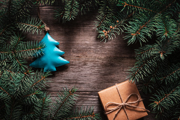 Wall Mural - A frame of fir branches and  gift paper box tied with twine. Christmas card blank.