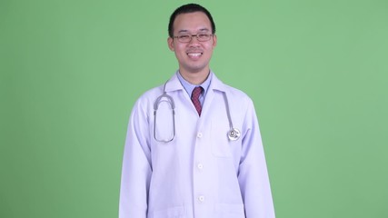 Poster - Happy Asian man doctor with eyeglasses smiling