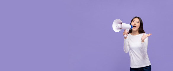 woman announcing on magaphone on purple banner background