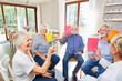 © Robert Kneschke - Seniors do exercise in group therapy