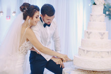 The Bride Cut Her Cake With Her Husband