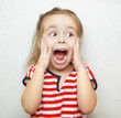 © Ilshat - Funny little girl taken aback by great surprise