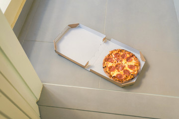 Wall Mural - Open box of pizza on home doorstep on front porch. Delivery. Concept