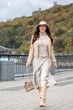 stylish woman walks along the promenade