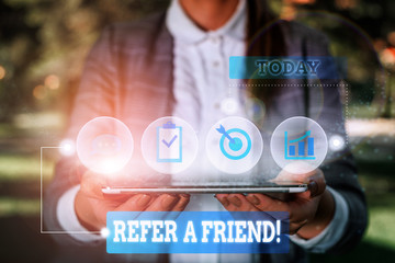 Poster - Word writing text Refer A Friend. Business photo showcasing direct someone to another or send him something like gift Female human wear formal work suit presenting presentation use smart device