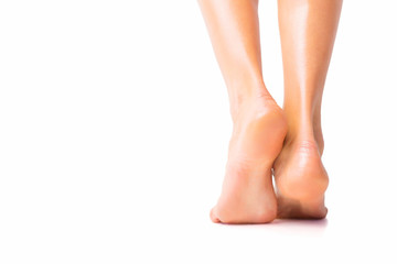 woman with bare foot standing
