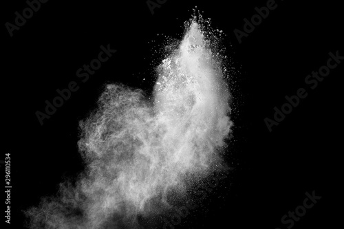abstract white powder splatter on black background,Freeze motion of white pow...