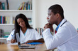 © Daniel Ernst - Thinking african american doctor with nurse