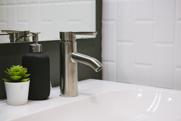 Bathroom interior with sink and faucet.