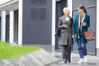 © AnnaStills - Two friends in elegant stylish clothing walking together along the street and drinking coffee