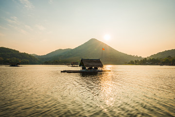 Canvas Print - Cottage raft floating on river