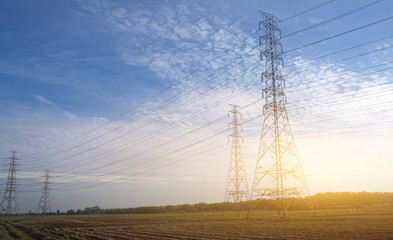 high voltage post or high voltage tower sky sunset use for electrical transmission system background or banner concept, landscaping shot photo.