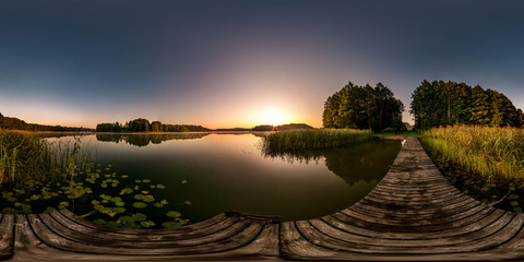 Wall Mural - full seamless spherical hdri panorama 360 degrees  angle view on wooden pier of huge lake or river in morning with pink sunrise mist fog in equirectangular projection, VR content