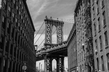 Wall Mural - View of one of the towers of the Manhattan Bridge from the streets of the DUMBO district, Brooklyn, NYC black and white