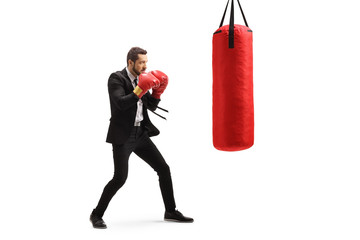 Sticker - Businessman in a suit training box with a punching bag