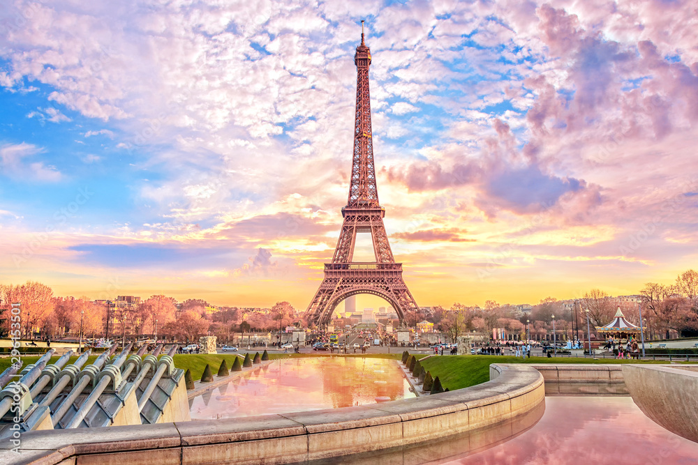 Eiffel Tower at sunset in Paris, France. Romantic travel background - obrazy, fototapety, plakaty 