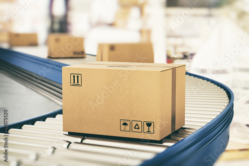 Fotomural Cardboard boxes on conveyor rollers ready to be shipped by courier for distribut