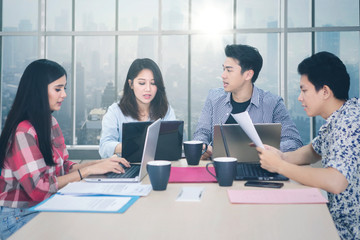 Poster - Busy business team working together in the office