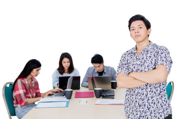 Wall Mural - Male confident entrepreneur with his team on studio