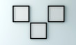 © justyle - Blank black picture frame for insert text or image inside on light blue color wall.