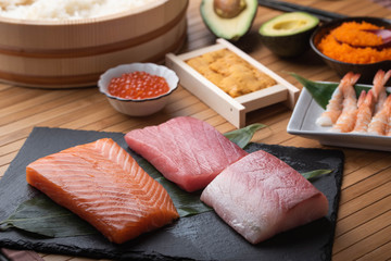 Wall Mural - sushi ingredients, tuna, salmon, yellow tail, sea urchin, salmon roe, shrimp, rice