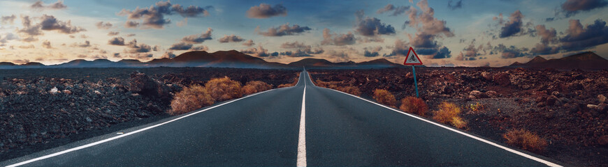 image related to unexplored road journeys and adventures.road through the scenic landscape to the de