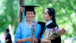 Portrait of  Asian woman wears a hat for her grandmother on graduation day