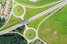 Aerial Top View Of Suburb Road Intersection And Green Fields In Summer Time