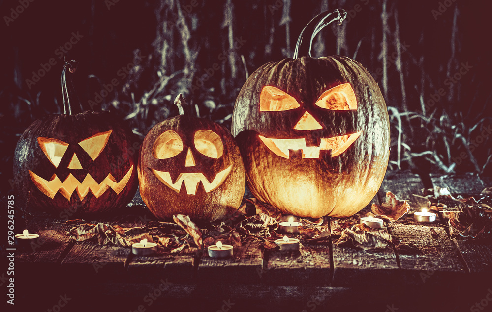 Foto de Stock Halloween pumpkins head jack lantern with candles around ...