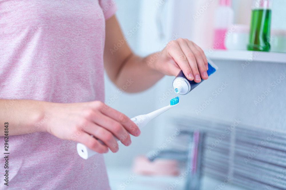 Brushing teeth using ultrasonic electric toothbrush and toothpaste in ...