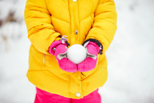Perfect Snowball In Little Girl Hands In Pink Gloves