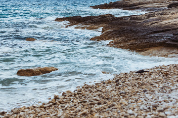 Wall Mural - view of rocky sea beach in storm weather