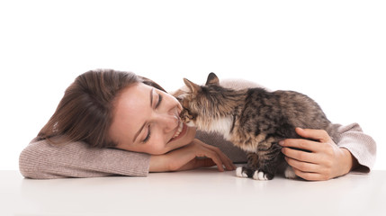 Young woman with cat on white background. Owner and pet